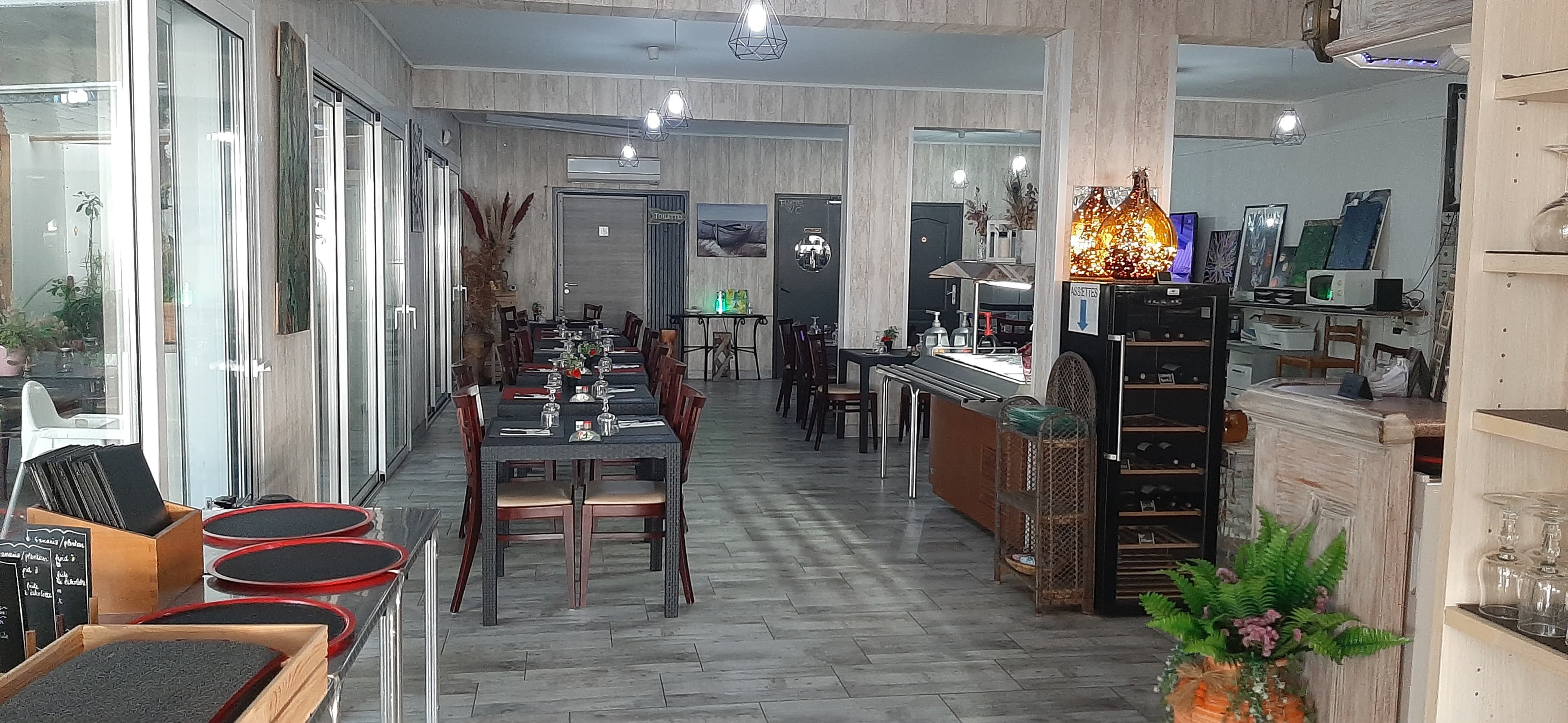 Dining room seen from the entrance, tables ready for service